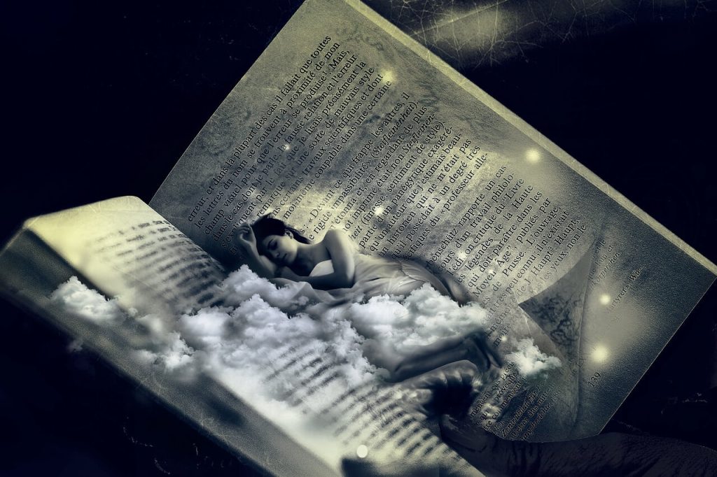 mulher dormindo no meio do livro